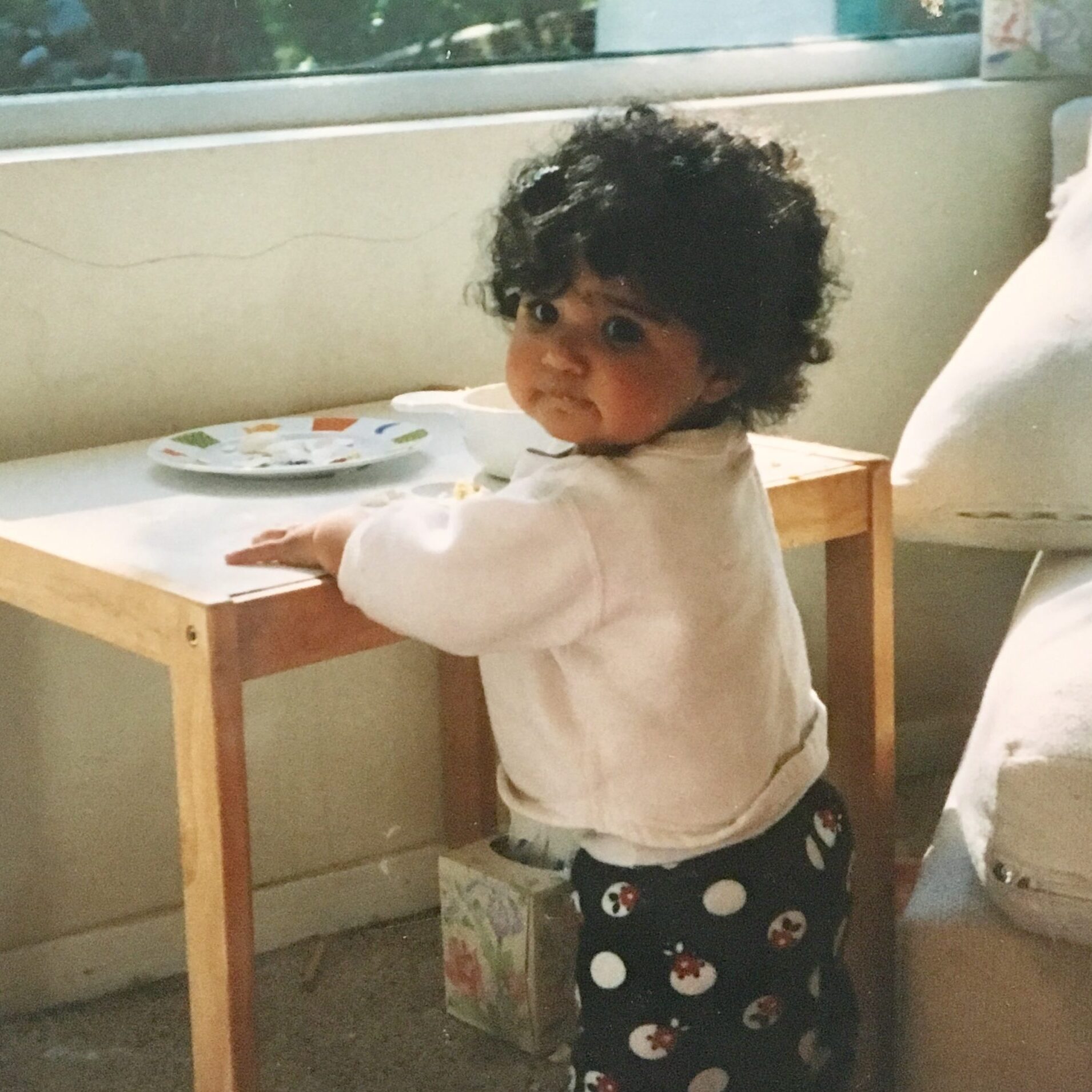 toddler playing on small table